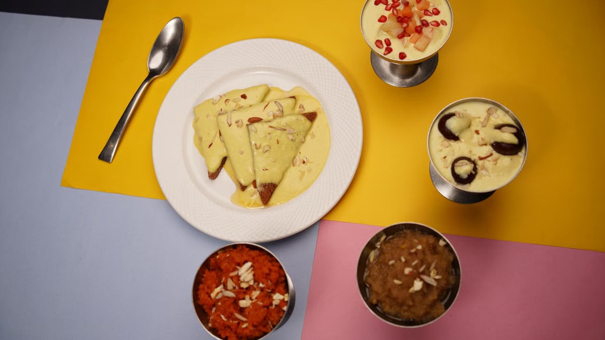 An array of Indian desserts with vibrant plating on a colorful background, highlighting shahi tukda.